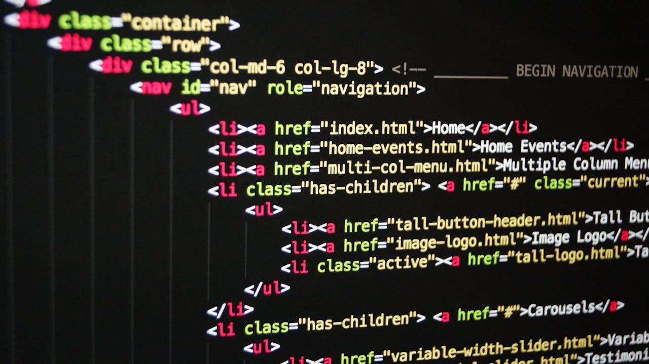services-03 Close-up of vibrant HTML code displayed on a computer screen, showcasing web development and programming.