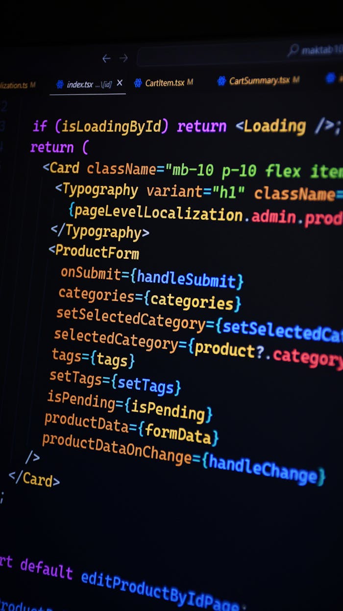 gallery-6 Close-up of JSX code on a monitor, showcasing colorful syntax used in ReactJS development.