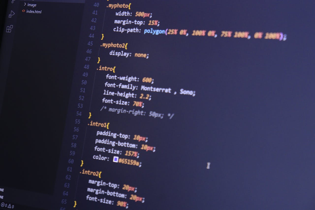 why-choose-us Focused shot of HTML and CSS code on a monitor for web development.